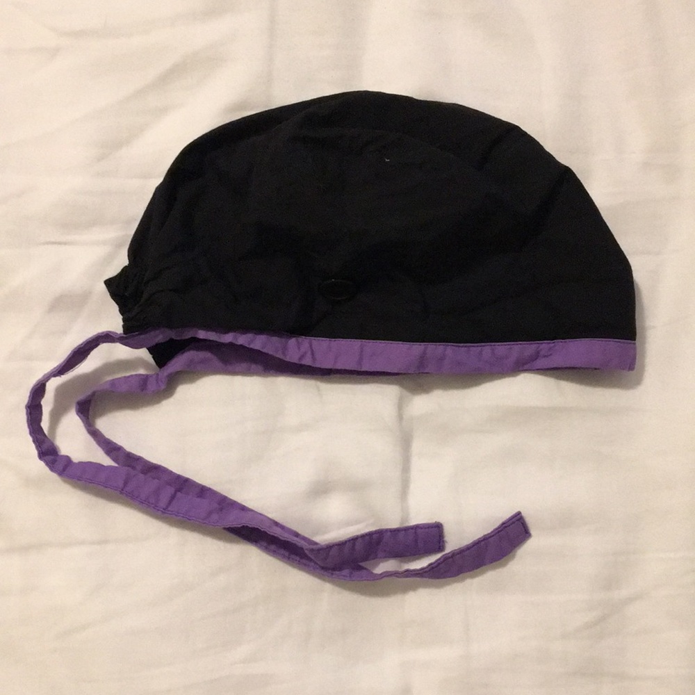 Black scrub cap with buttons, purple detail